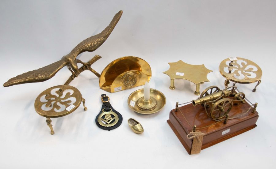 A selection of antique and vintage brass items including a vintage brass cannon desk ornament,