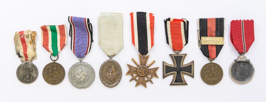 A selection of WWII era German medals, to include: a 2nd class Iron Cross (marked 65 for Klein &