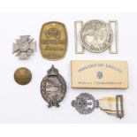 A selection of reproduction/Post-War medals/badges, to include: a Waffen SS brass tag; an SS belt