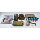 one box containing various items of military interest; ten dummy grenade launcher rounds, 40x46, one