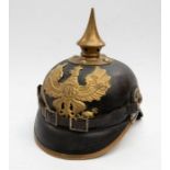 WWI era German Prussian Pickelhaube helmet, black lacquered leather body with gilt brass coat of