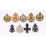 A selection of British Rifles Regiments cap badges including First Surrey Rifles blackened brass