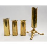 A collection of four trench art spill vases, including a matched pair of trench WWI era 37mm shell