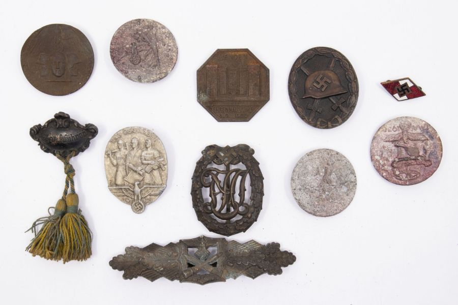 A selection of WW2 and earlier German badges. To include: a close combat clasp in bronze, marked