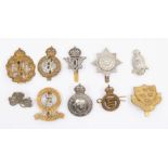 A selection of British Regimental cap badges including a 5th Royal Inniskilling Dragoon Guards white