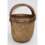 A late 19th/ early 20th century Chinese woven cane cabbage basket of traditional form, with three