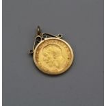 A George V sovereign dated 1913, in a pendant setting (hallmarked 9ct). gross weight 9.7gm