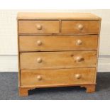 A Victorian pine chest of drawers having two short and three long drawers with bun handles, width