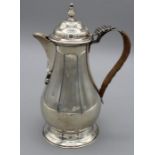 An early 20th century sterling silver chocolate jug with heart shaped spout, approximate weight