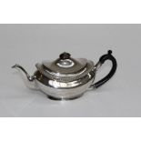 Allen and Daws, Norwich, an Edwardian silver teapot of oval shape, with gadrooned rim and ebonised