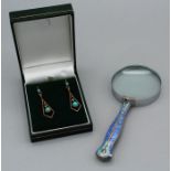 A Sterling silver and enamel handled magnifying glass and a pair of yellow metal (tested as 9ct