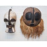 Two 20th century Congolese carved wood Luba kifwebe - style masks, one with grass beard fringe (36cm