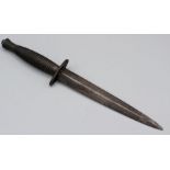 A Fairburn Sykes third pattern fighting knife with ribbed handle, crow's foot stamped guard and