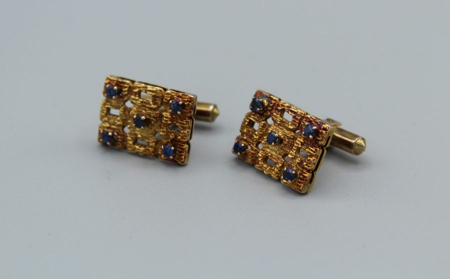 A pair of sapphire set brutalist cufflinks, gross weight 12.2gms, stamped 14k