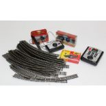 A quantity of track and controllers along with various accessories, vehicles and tools ( 00 Gauge)