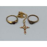 A 9ct gold diamond and ruby cross on a chain,1.5gm plus two 9ct gold rings, one set with ruby and