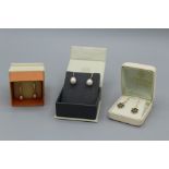 A pair of plated 18carat gold earring set with sapphires, a pair of orangey/pink cultured pearl