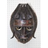 A 20th century cast bronze African tribal mask with woven grass collar, 45cm