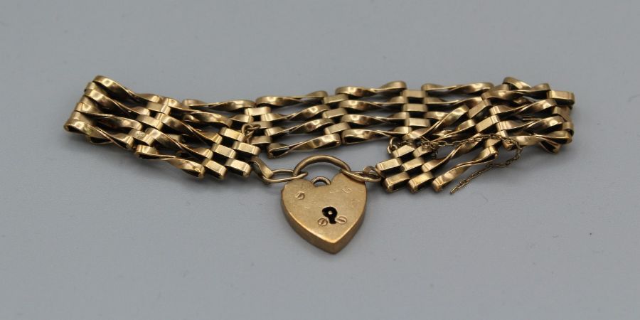 A 9ct yellow gold gate bracelet with padlock clasp. Gross weight approximately 15.3gm