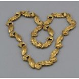 An Italian stylised acanthus leaf necklace stamped 750, tested 18carat gold, and signed by Fabbrini