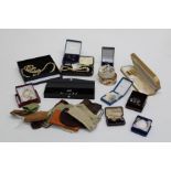 A quantity of early 20th century costume jewellery to include vintage boxes, simulated pearls and