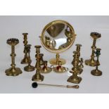 A quantity of brassware including five pairs of candlesticks one pair in Gothic revival style