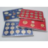 Four plastic sleeves with coinage sets of Great Britain including 1942-67 shilling English Scottish