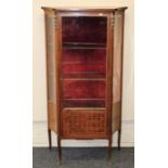 A transitional style mahogany and parquetry vitrine enclosed by a glazed panel door, height 139cm