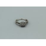An 18ct white gold diamond cluster ring with total diamond weight of approx 0.45ct, 3.8gm approx