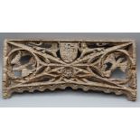 A small carved and pierced oak panel, possibly 17th century, worked with shield and rampant lions,