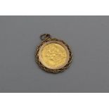 A George V half sovereign, dated 1913, in a 9ct gold mount. Gross weight approximately 5.5gm