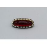 A seed pearl and red cabochon setting early 19th century brooch