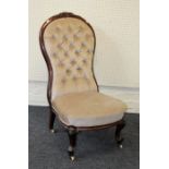 A Victorian carved walnut framed parlour chair upholstered in velvet dralon, raised on cabriole legs
