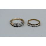 A 9ct gold diamond illusion set ring, plus a cubic zirconia half hoop ring in 9ct gold. Total