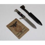 A WWII Hitler Youth hand book, together with a dagger, the 14cm blade etched ' Blut und Ehre.