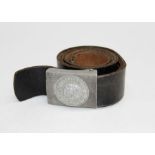 A WWII German leather belt, the white metal buckle inscribed ' Got Mit Uns'