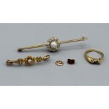 A selection of gold jewellery comprising a pearl and diamond bar brooch, a seed pearl foliate