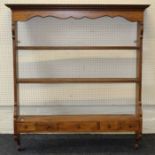 A set of 18th century style oak hanging shelves having drawers below, width 110cm