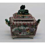 A 20th century Oriental porcelain pot pourri and cover of sarcophagus form with kylin finial,