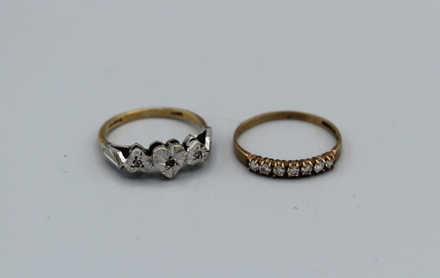 A 9ct gold triple heart ring set with three small diamonds , weight approximately 2.4gm, along