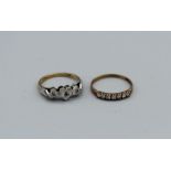 A 9ct gold triple heart ring set with three small diamonds , weight approximately 2.4gm, along