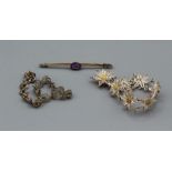 A 15ct stamped bar brooch, set with amethyst, plus a pair of silver filligree bracelets, one in