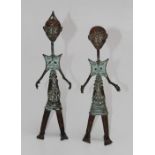 A pair of 20th century Benin type cast and wrought metal figures, 33cm high