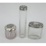 Three antique silver topped dressing table jars