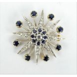 Diamond and sapphire starburst brooch containing approx 4.5ct of diamonds