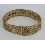 A 1970s three colour 9ct gold link bracelet, 35 Grams