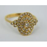 18ct yellow gold and diamond Art Deco style cocktail ring of 3 step oval form