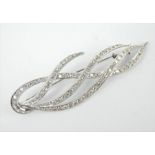 A good sized diamond encrusted platinum naturalistic brooch