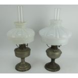 Two vintage Aladdin oil lamps with opaline shades