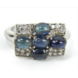 Platinum Art Deco inspired four cabochon sapphire and diamond ring.